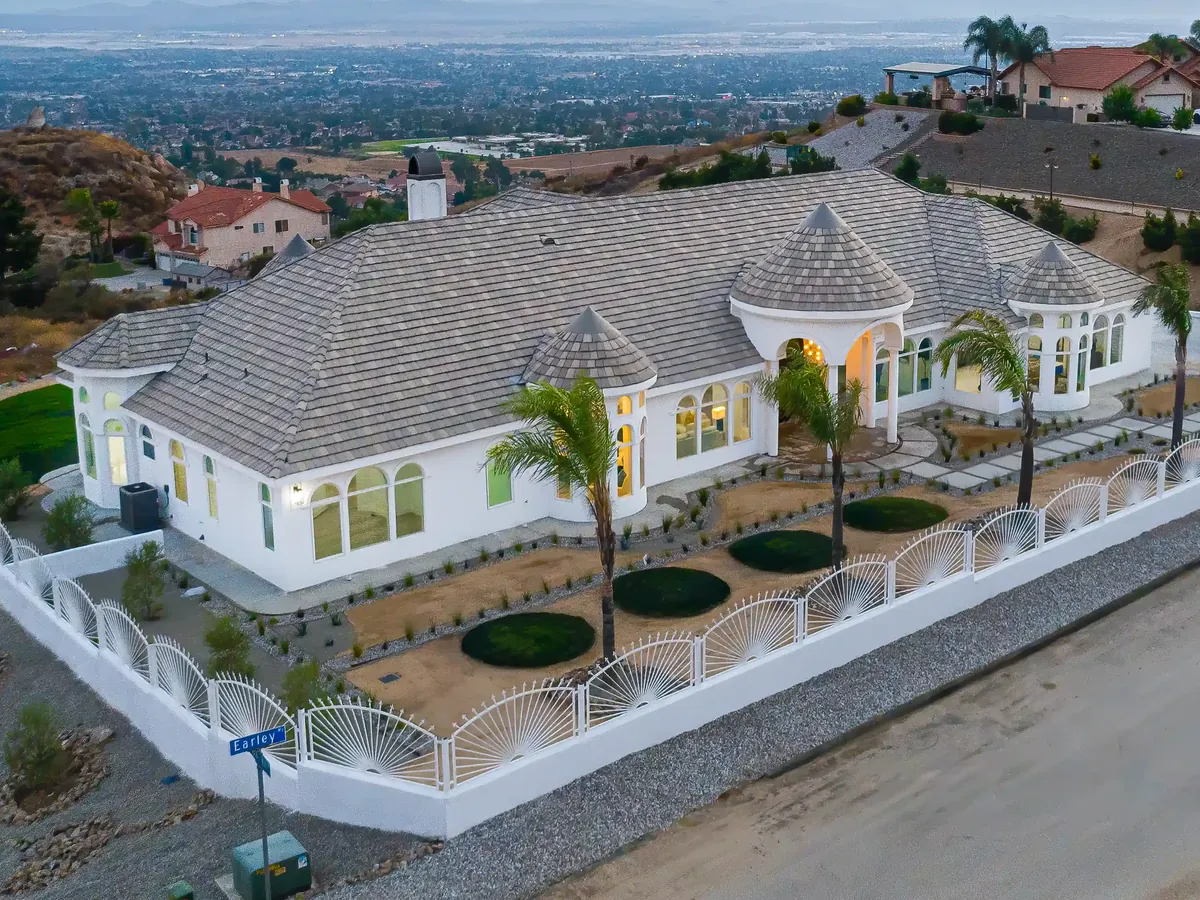 Tile roof on a single-story home in the hills, seen from the air